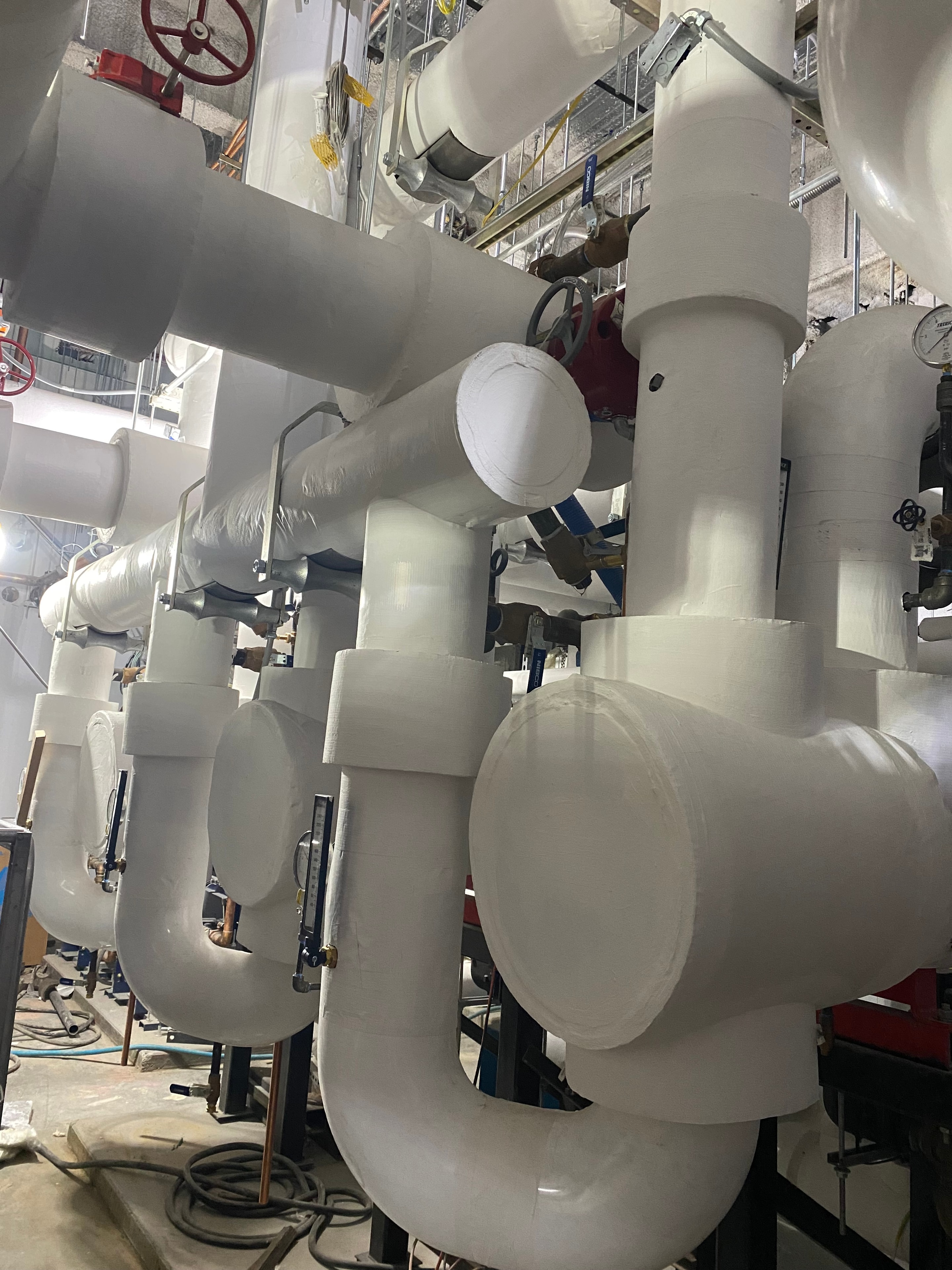 ThermalEdge insulation work — silver HVAC ductwork